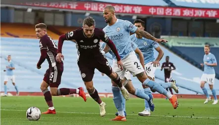  ??  ?? Killer instinct: Manchester City’s Kyle Walker fouls Leicester’s Jamie Vardy (second from left) during the English Premier League match at the Etihad.