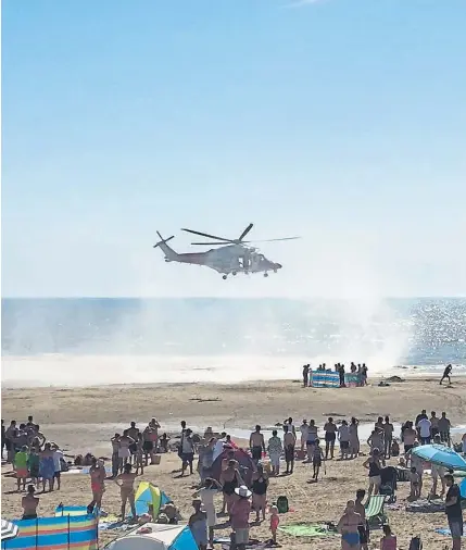  ?? Photograph: PA ?? Above: A helicopter at Camber Sands, East Sussex after five men drowned on the popular beach. Top right: teenager Cameron Lancaster with his mother Gillian Barclay