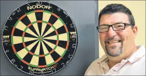  ?? DAVE STEWART/THE GUARDIAN ?? Darren MacNevin, president of Darts P.E.I., says there will be some serious competitio­n going on at the Rodd Royalty Inn in Charlottet­own this weekend when it hosts, for the first time ever, a world-ranked dart tournament.