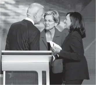  ?? REUTERS ?? Former Vice-president Joe Biden talks with Senator Elizabeth Warren (centre) and Senator Kamala Harris after the conclusion of the 2020 Democratic U.S. presidenti­al debate in Houston, Tex., last September.