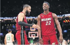  ?? AFP ?? The Heat’s Caleb Martin, left, and Jimmy Butler during a play-off game.