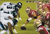  ?? TONY AVELAR — THE ASSOCIATED PRESS FILE ?? San Francisco 49ers center Ben Garland (63) prepares to snap the ball at the line of scrimmage against the Philadelph­ia Eagles in Santa Clara on Sunday, Oct. 4.