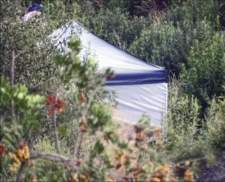  ?? Signal file photo ?? A tent at the edge of a homeless encampment can be seen from a third-floor balcony at the Castaic Lake Senior Village in Castaic in this June 6, 2022, Signal file photo.