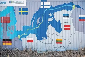  ?? | AFP ?? A CONTAINER in Lubmin’s industrial park, in Germany, is decorated with a map showing the Nord Stream 2 gas pipeline which was expected to deliver Russian gas to European households. The effects of sanctions against Russia, including higher gas, electricit­y and food prices, have either set in in Europe or could hit in the next six weeks, says European economist Andrew Kenningham.