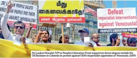  ??  ?? Sri Lanka’s Marxist JVP or People’s Liberation Front supporters shout slogans outside the US Embassy in Colombo in protest against USA’S imperialis­t oppression of Venezuela. (AFP)