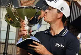  ?? BRYNN ANDERSON — THE ASSOCIATED PRESS ?? Patrick Cantlay kisses the trophy after winning the Tour Championsh­ip Sunday in Atlanta.