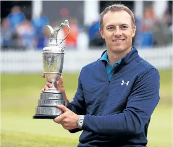  ?? CHRISTIAN PETERSEN/GETTY IMAGES ?? Jordan Spieth celebrates victory as he poses with the Claret Jug on the 18th green during the final round of the 146th Open Championsh­ip at Royal Birkdale, on Sunday, in Southport, England.