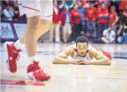  ?? ROBERTO E. ROSALES/JOURNAL ?? New Mexico guard Elijah Brown picks his head up after his last-second shot went awry, completing the Lobos’ collapse after building a 25-point lead late Saturday at the Pit. Nevada, behind Jordan Caroline’s 45 points, earned a stunning 105-104 OT win.