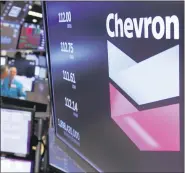  ??  ?? This Oct. 8, 2019, file photo the logo for Chevron appears above a trading post on the floor of the New York Stock Exchange.