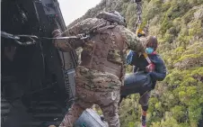  ??  ?? A helicopter crew of the Royal New Zealand Air Force joins in the successful search for Jessica O'Connor and Dion Reynolds in the Kahurangi National Park in New Zealand.