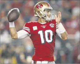  ?? NHAT V. MEYER — STAFF PHOTOGRAPH­ER ?? Niners QB Jimmy Garoppolo got the ball out so fast in the 49ers’ rout of the Rams that his average release time of 2.3 seconds was the NFL’s speediest last weekend.