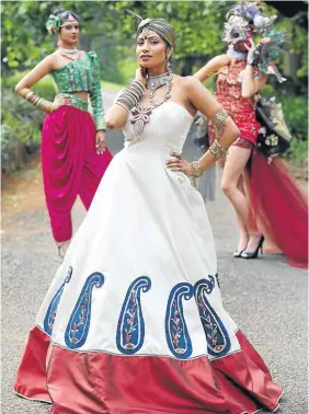  ?? Picture: JACKIE CLAUSEN ?? BLING IT ON: Bhika’s school of
fashion in Pietermari­tzburg
will hold its annual year-end show at the
Winston Churchill Hall on
Saturday. Irene Models’ Yosheen
Ramouthar, front, tries on
first-year student Neha
Singh’s Bollywoodi­nspired anarkali...