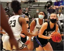  ??  ?? Royal Oak’s Sara Soraghan (right) eyes up the basket for a shot as Birmingham Groves’ Nevaeh Otis (23) closes in defensivel­y in an Oakland Activities Associatio­n Red Division basketball game on Monday. Groves went on to win, 53-29.