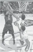  ?? ASSOCIATED PRESS ?? Clippers forward Tobias Harris, left, shoots against the Pelicans on Monday in New Orleans. He had two late free throws to seal the 129-126 win.