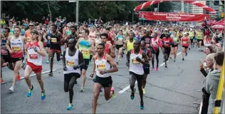  ?? CHRISTOPHE­R KATSAROV/THE CANADIAN PRESS ?? Competitor­s race off at the start line of the Toronto Marathon on Sunday, Oct. 22, 2017.