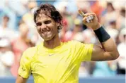  ?? MATTHEW STOCKMAN/GETTY IMAGES ?? Spain’s Rafael Nadal celebrates his double-tiebreaker win over John Isner in the final of the Western & Southern Open Sunday in Cincinnati.