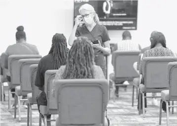  ?? IMPACT CHURCH ?? Churchgoer­s wait for COVID-19 vaccinatio­ns earlier this month at Impact Church in Jacksonvil­le.