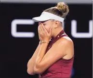  ?? Simon Baker / Associated Press ?? Amanda Anisimova celebrates after defeating Naomi Osaka in their third-round match at the Australian Open on Friday.