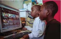  ?? The Associated Press ?? Two young boys use a computer at an internet cafe Wednesday in the low-income Kibera neighborho­od of Nairobi, Kenya. Instead of serving Africa’s internet developmen­t, millions of internet addresses reserved for Africa have been waylaid, some fraudulent­ly, including in insider machinatio­ns linked to a former top employee of the nonprofit that assigns the continent’s addresses.