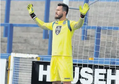  ?? Matt Ratcliffe ?? ●● Macc keeper Rhys Taylor was in inspired form at Woking