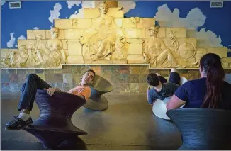  ??  ?? Visitors take a spin on the top chairs at the City Museum in St. Louis.