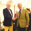  ??  ?? Mervyn Clark and Tim Trembath shake on the Essex hunts merger