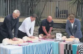  ?? ?? Practical experience: Heart of the Nation founder Greg Page with CPR class celebrity participan­ts Brett Lee, Daniel Gay and Richard Wilkins.