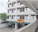  ??  ?? HERE TO STAY: The Myawaddy Hotel has clean and comfortabl­e rooms — albeit small — and functionin­g aircon and hot water.