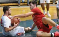  ??  ?? Oneida senior Vinny Leibl and VVS junior Bailey Janowski fight for control of a loose ball during TVL Pioneer Division play on Jan. 11.