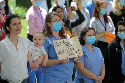  ?? STUART CAHILL / HERALD STAFF ?? ‘MY BODY, MY CHOICE’: MGH employees and supporters at an Abortion Rights protest held at Massachuse­tts General Hospital in Boston on Wednesday.