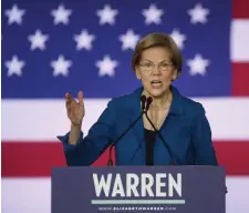  ?? NANCY LANE PHOTOS / HERALD STAFF ?? HANGING ON: U.S. Sen. Elizabeth Warren speaks Tuesday at her primary night event in Manchester, N.H. XXXXX, supporters cheer Warren.