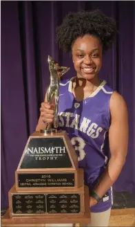  ?? MARK BUFFALO/RIVER VALLEY & OZARK EDITION ?? Central Arkansas Christian senior Christyn Williams holds the Naismith Trophy she received Wednesday as the top high school basketball player in the country. Williams’ many acolades also include being named the River Valley & Ozark Edition Girls Player...