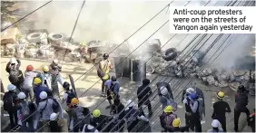  ??  ?? Anti-coup protesters were on the streets of Yangon again yesterday