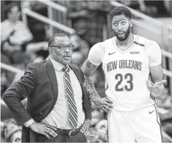  ?? Elizabeth Conley / Staff photograph­er ?? Pelicans forward Anthony Davis, right, is at the center of the NBA rumor vortex, and the Rockets, as always with GM Daryl Morey, are in the hunt to upgrade their talent.