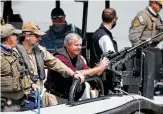  ??  ?? Republican U.S. Sens. Ted Cruz of Texas, second from left, and Lindsey Graham of South Carolina, center, return from a ride in a Texas DPS boat.