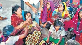  ?? HT PHOTOS ?? The inconsolab­le mother of five-year-old Aditya, who died after suffering 100% burns; and (right) the gutted remains following a fire at Teur village in Kharar on Tuesday afternoon.