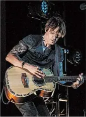  ?? ANDY SNYDER/GUITAR MONKEY ENTERTAINM­ENT ?? Keith Urban performs for more than 200 medical workers Thursday at the Stardust Drive-In theater in Tennessee.