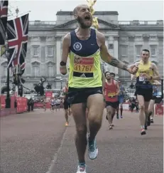  ??  ?? Thomas Musson finishes the London Marathon