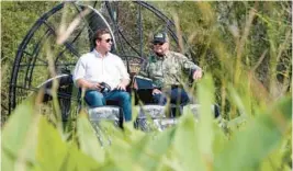  ?? WILFREDO LEE/AP ?? In 2018, then-candidate for governor Ron DeSantis, left, chats with “Alligator Ron” Bergeron during an airboat tour of the Florida Everglades in Fort Lauderdale. DeSantis appointed Bergeron to the South Florida Water Management District board Feb. 1, 2019, a position responsibl­e for flood protection, Everglades restoratio­n and water policy for 16 counties.