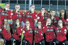  ?? SUN FILES ?? DAVE ABEL/TORONTO Team Canada celebrates winning the Bronze medal against Team Great Britian during the women’s rugby sevens bronze medal on Monday, Aug. 8.