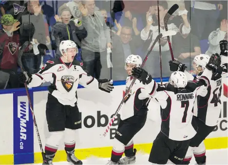  ?? MARK VAN MANEN ?? Vancouver Giants players celebrate Tyler Benson’s, left, second-period goal against the Victoria Royals during Game 3 of the WHL playoff series at the Langley Event Centre on Tuesday.
