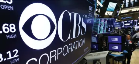  ?? AP FILE ?? ENTERTAINM­ENT WARS: CBS, whose logo was displayed Tuesday at the New York Stock Exchange, above, is merging with Viacom to help challenge streaming companies like Netflix.