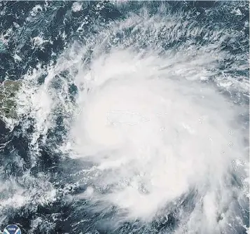  ?? (Photo: AP) ?? This satellite image provided by NOAA shows Hurricane Fiona in the Caribbean on Sunday, September 18, 2022. The eye of newly formed Hurricane Fiona is near the coast of Puerto Rico — and it has already sparked an island-wide blackout and threatens to dump “historic” levels of rain.