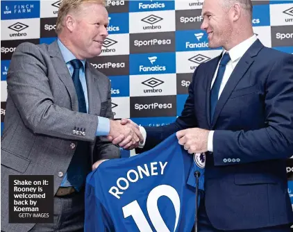  ??  ?? Shake on it: Rooney is welcomed back by Koeman