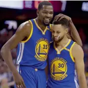  ?? — AFP — AP ?? Golden State Warriors’ Kevin Durant (left) and Stephen Curry in Game 4 of the NBA Finals.