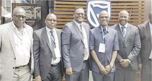  ??  ?? Stanbic Bank Chief Executive Leina Gabaraane (second right), hosting Zambian Government Officials and key stakeholde­rs at the Standard Bank Pavilion during the Investing in African Mining Indaba in Cape Town.