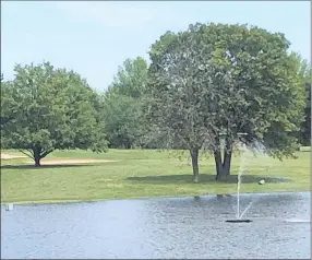  ?? RICK PECK/SPECIAL TO WEEKLY VISTA ?? Number 16 at the Cassville Golf Club requires a drive over a lake, but if you go straight at the green several trees may be in the way for your approach.