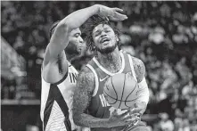  ?? David J. Phillip / Associated Press ?? Ben McLemore, right, was a key contributo­r for the Rockets in Friday night’s win, scoring a season-high 21 points.