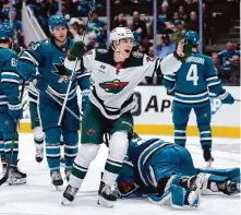  ?? Tony Avelar/Associated Press ?? Wild rookie Liam Ohgren (28) celebrates after scoring a goal in the second period against the Sharks on Saturday.