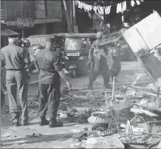  ?? AP PHOTO ?? Sri Lanka’s army soldiers remove the debris of a vandalized building in Digana, a suburb of Kandy, Sri Lanka.